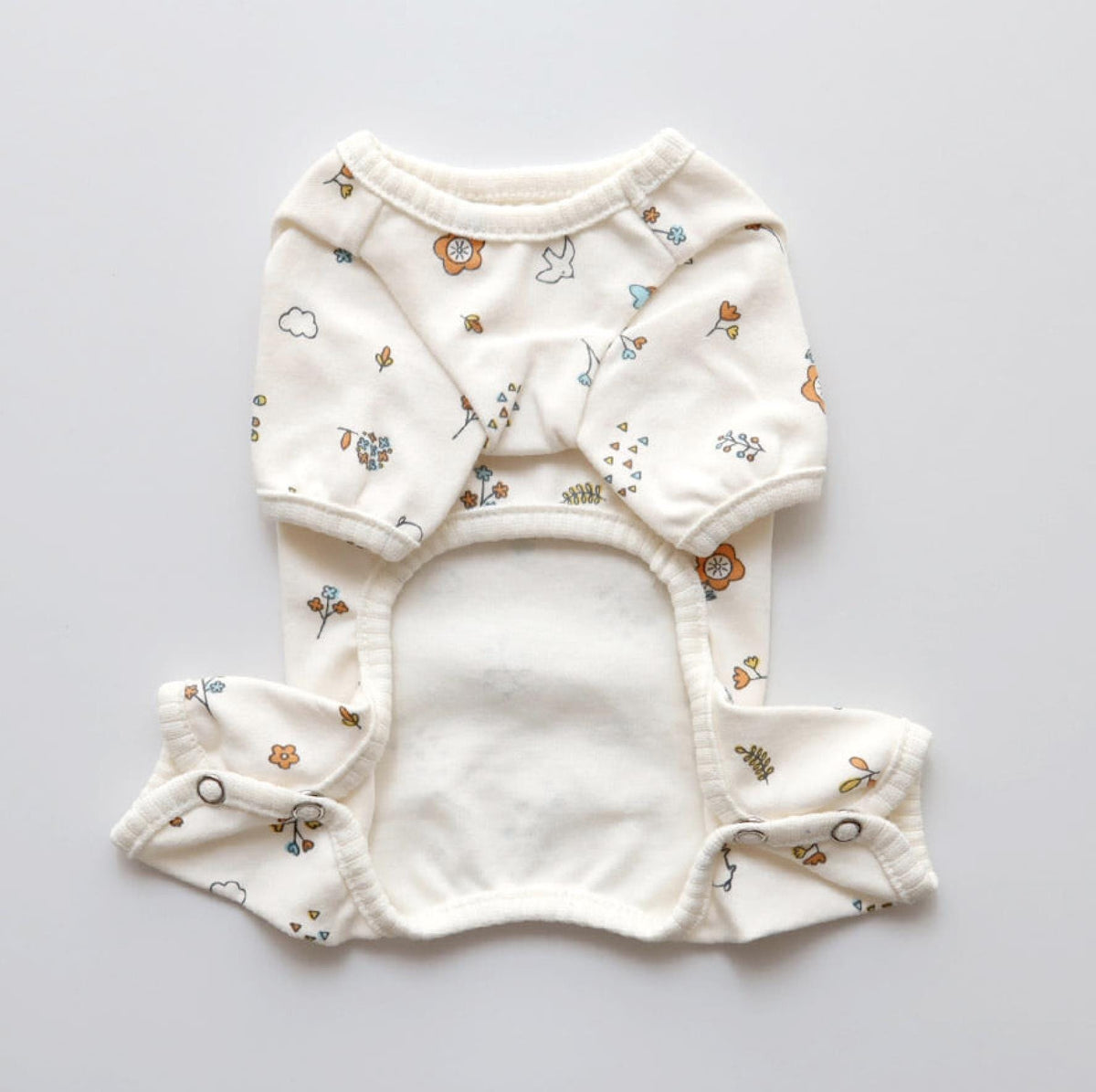 NKpup organic garden print overall and vest set for dogs in off-white with floral pattern