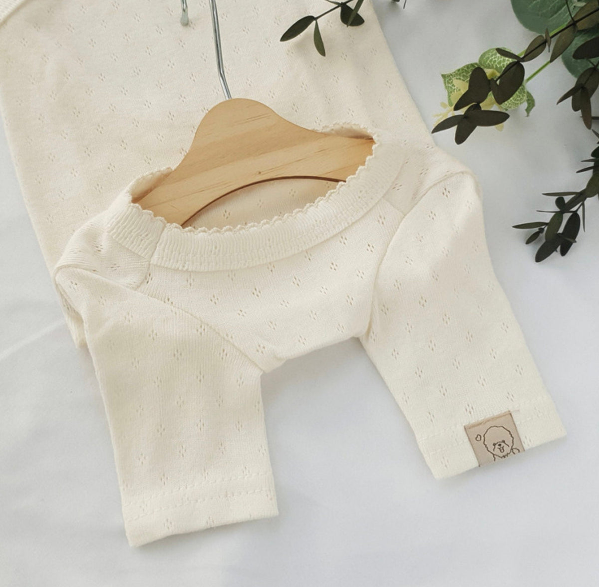 Cream white basic ribbed dog shirt with textured knit fabric