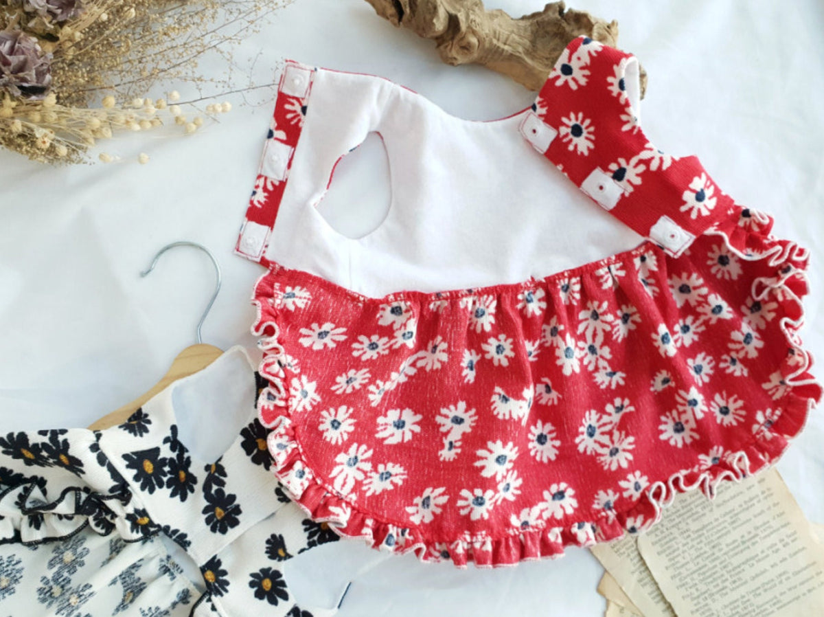NKpup floral corduroy dog dress in red with white daisy pattern and ruffled hem