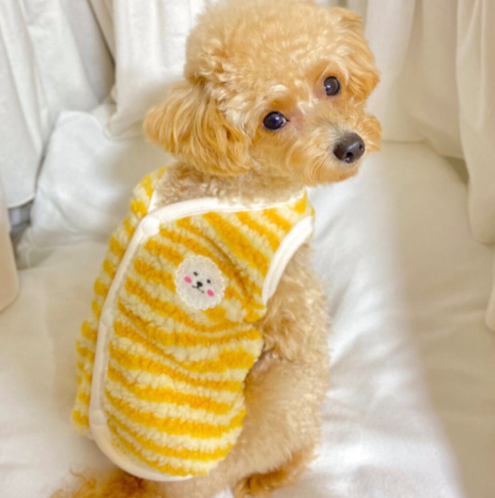 NKpup stripe fleece dog vest in yellow and white with a small bear patch