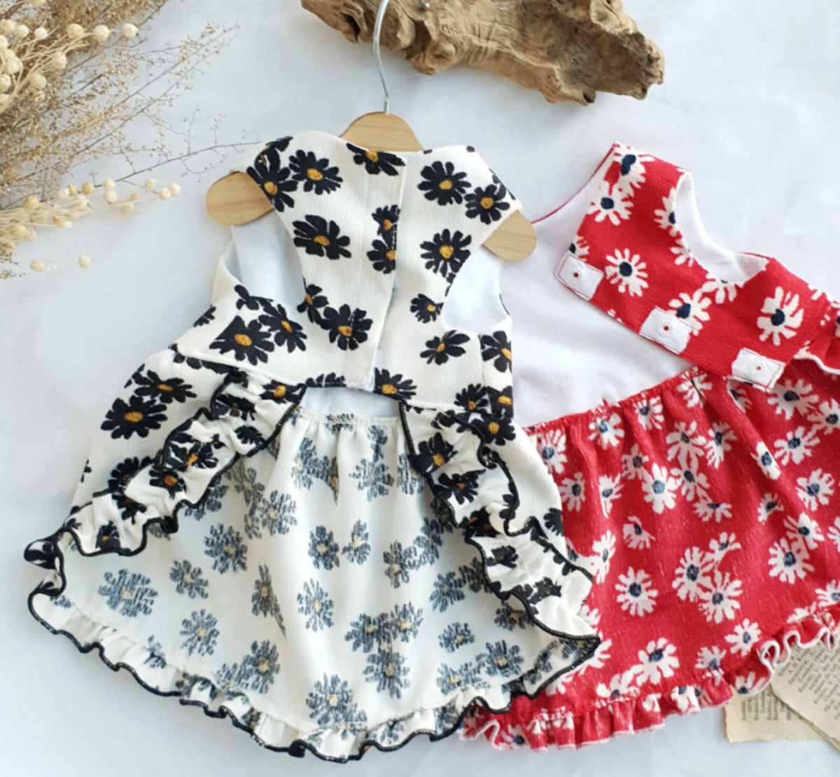 NKpup floral corduroy dog dresses in white with black daisies and red with white daisies