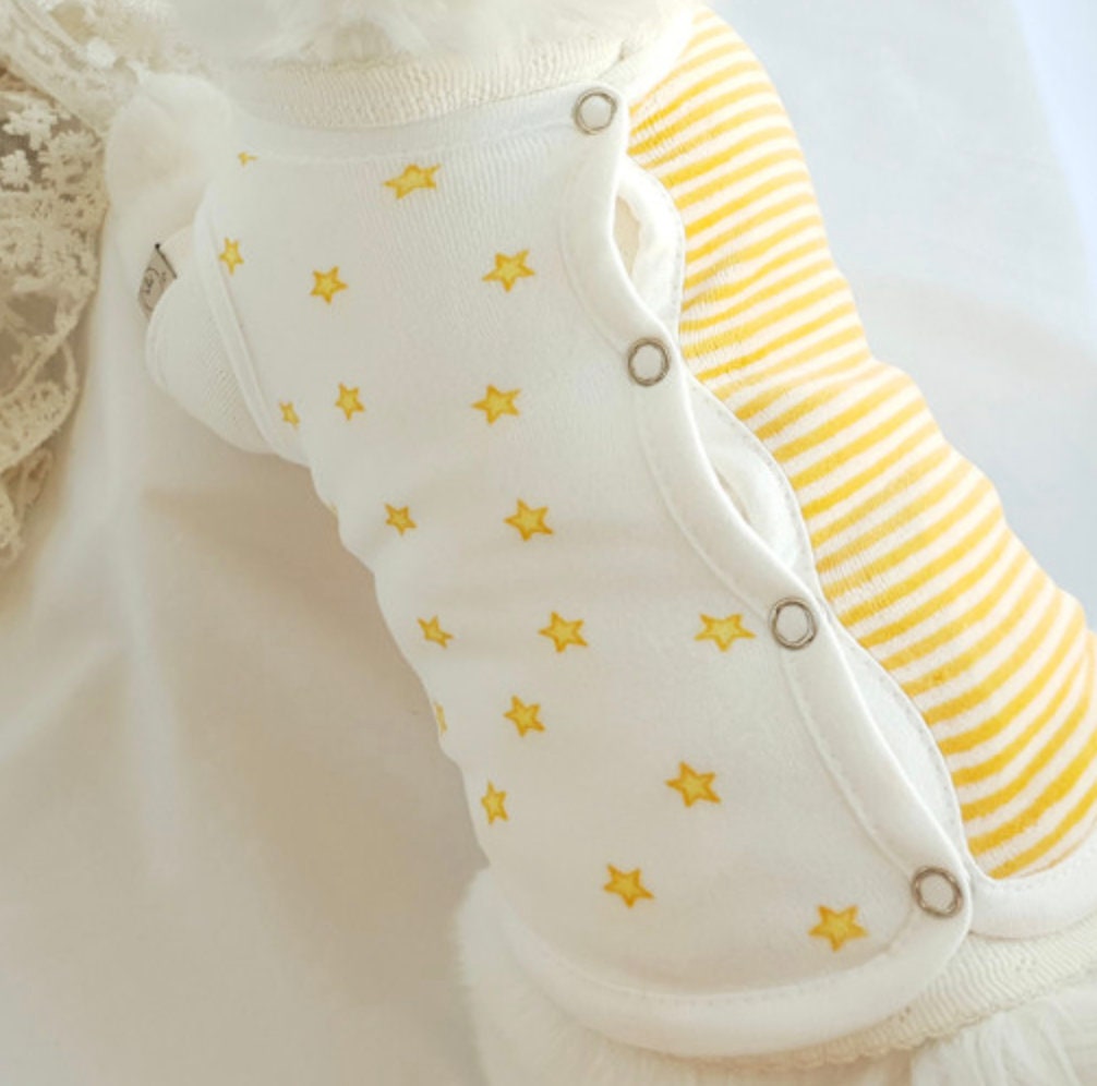 White Velour Star Dog Vest with yellow star pattern and striped sleeves