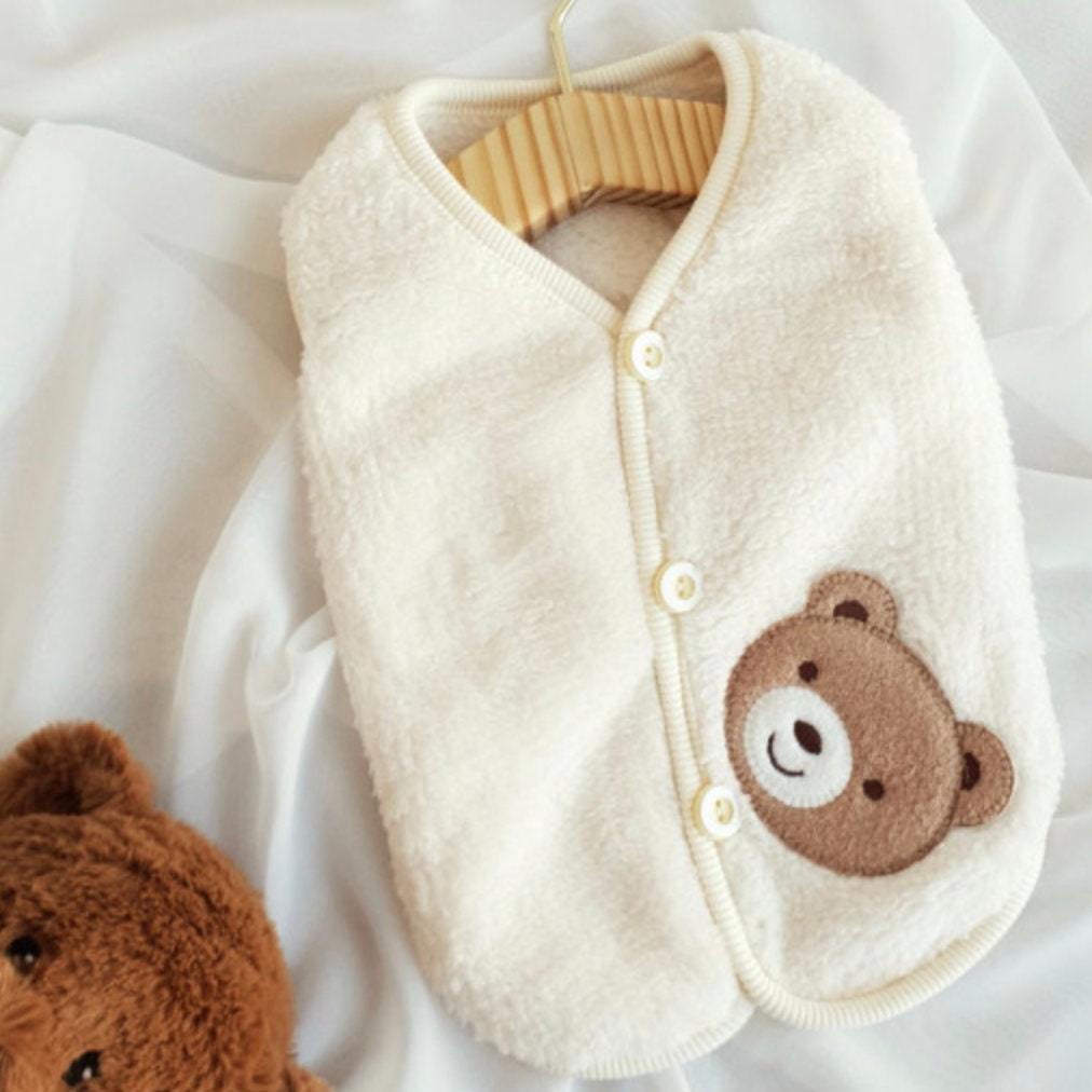 Cream teddy fleece dog vest with a cute brown bear patch