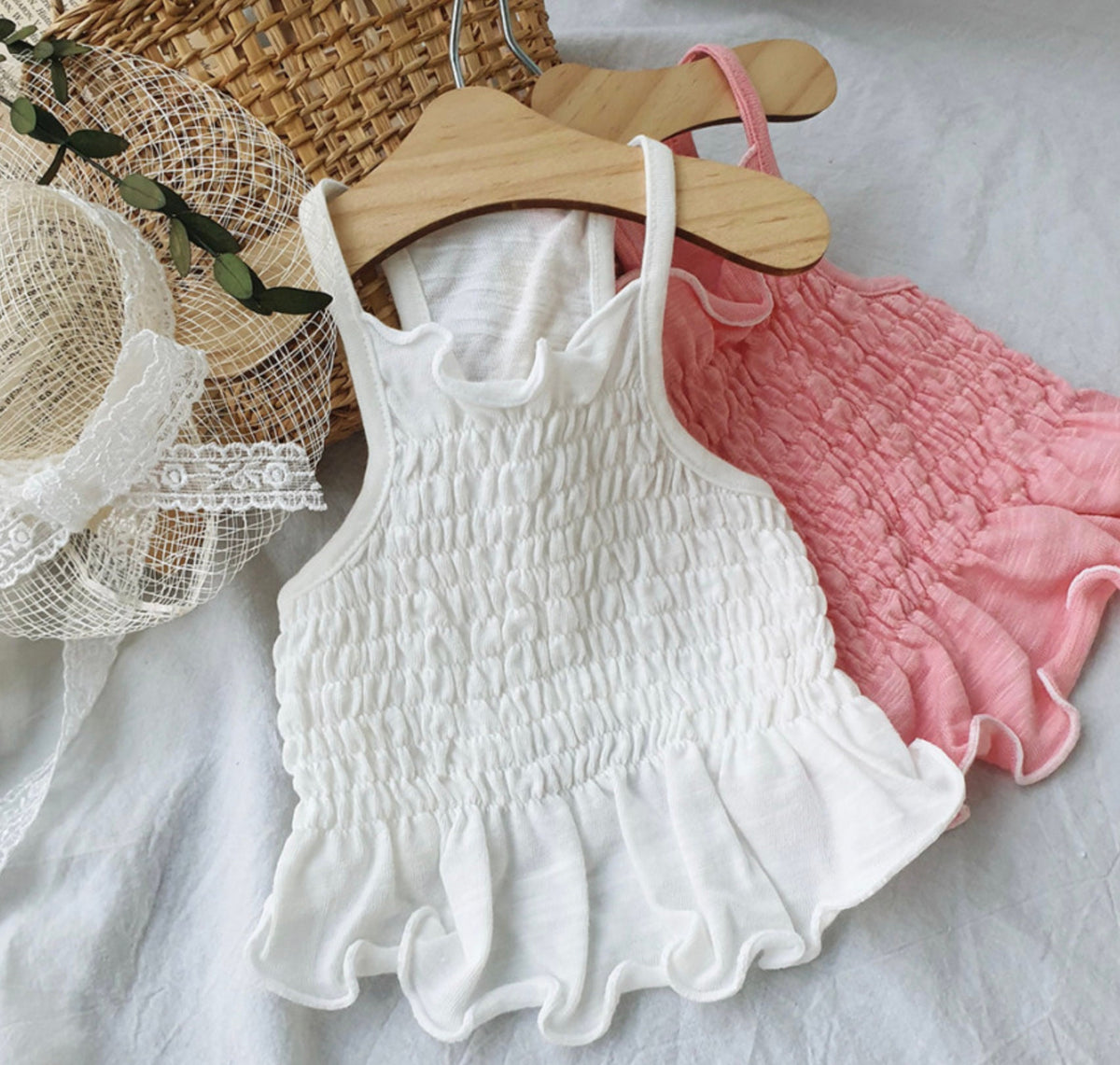 White and pink solid smocked dog crop tops with ruffled edges