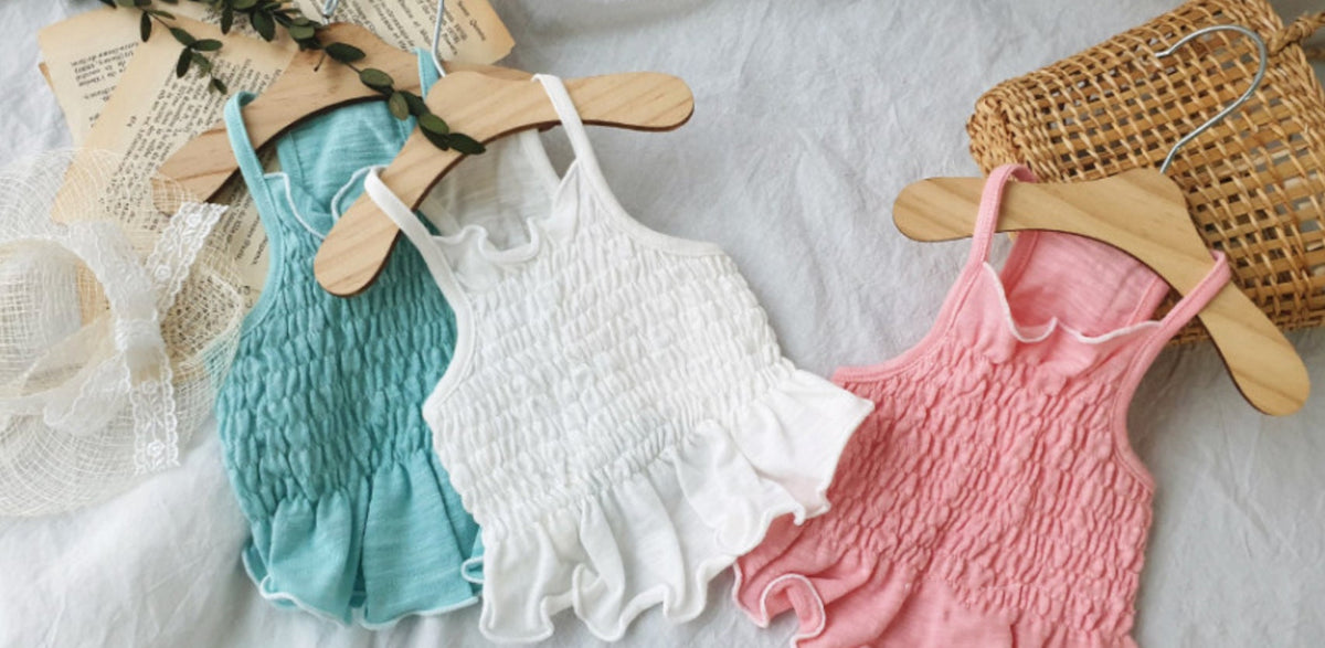 NKpup solid smocked dog crop tops in teal, white, and pink