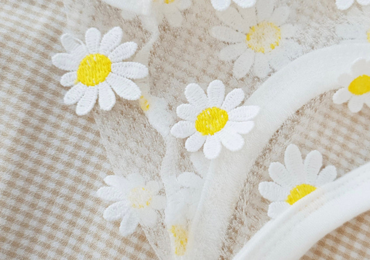 Close-up of NKpup Daisy Chiffon Dog Crop Top featuring white fabric with embroidered yellow and white daisies.