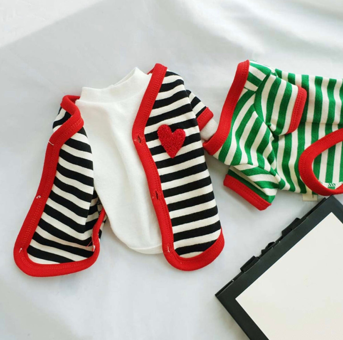 NKpup Heart Stripe Dog Cardigan in black and white with red trim and a red heart patch.