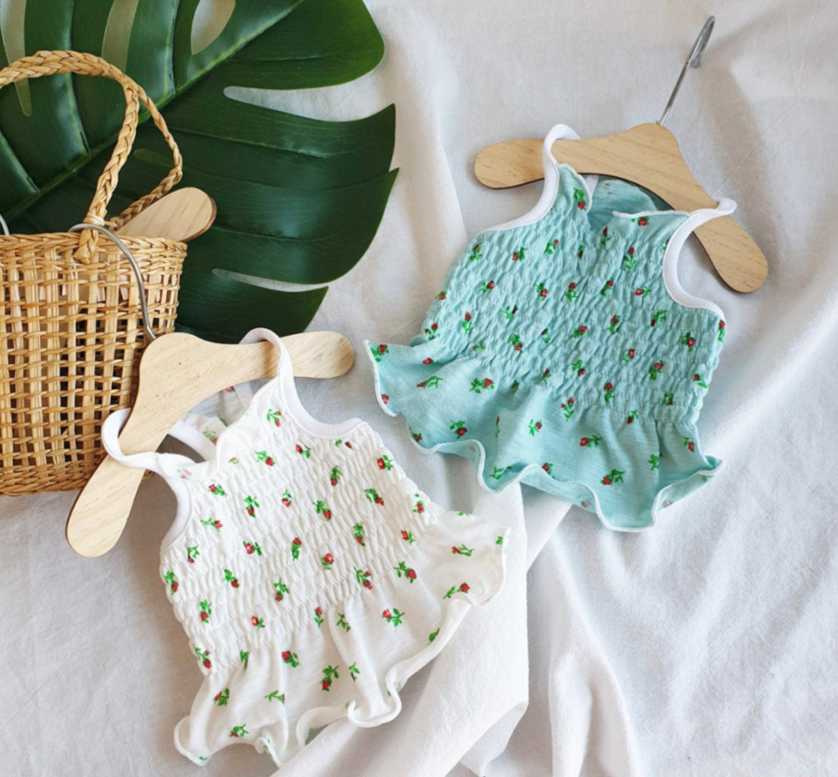 NKpup Rose Smocked Dog Crop Top in white and light blue with red rose patterns.