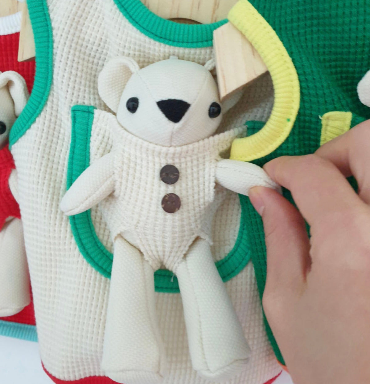 Plush teddy bear design on a white and green NKpup dog tank top