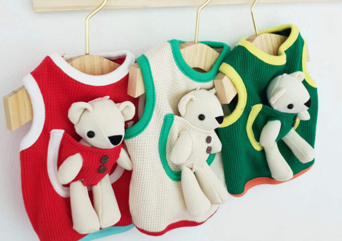 Set of three NKpup plush teddy bear dog tank tops in red, cream, and green.