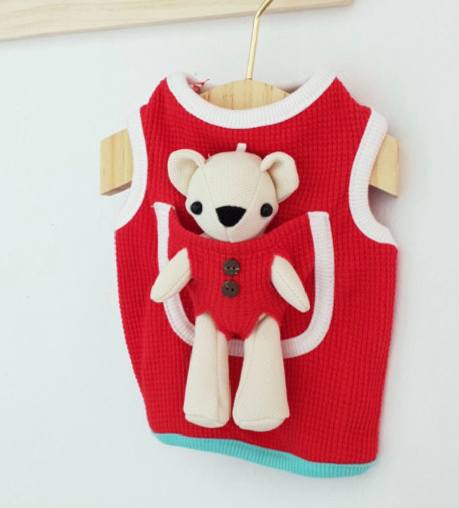 Red plush teddy bear dog tank top with white trim and decorative buttons