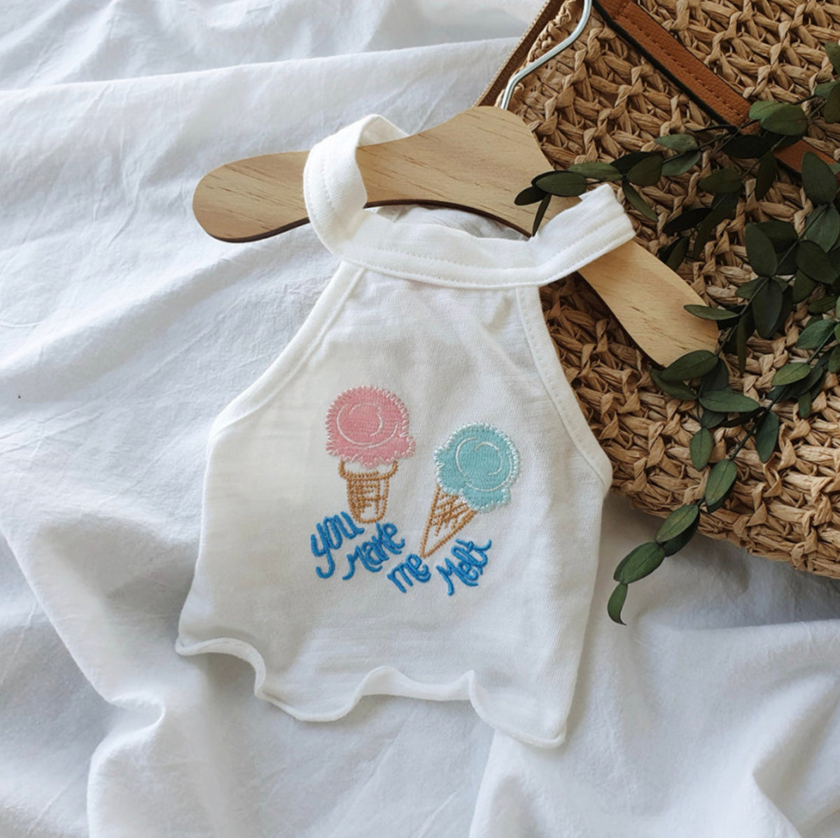 White NKpup dog crop tank top featuring embroidered ice cream cones and blue text.