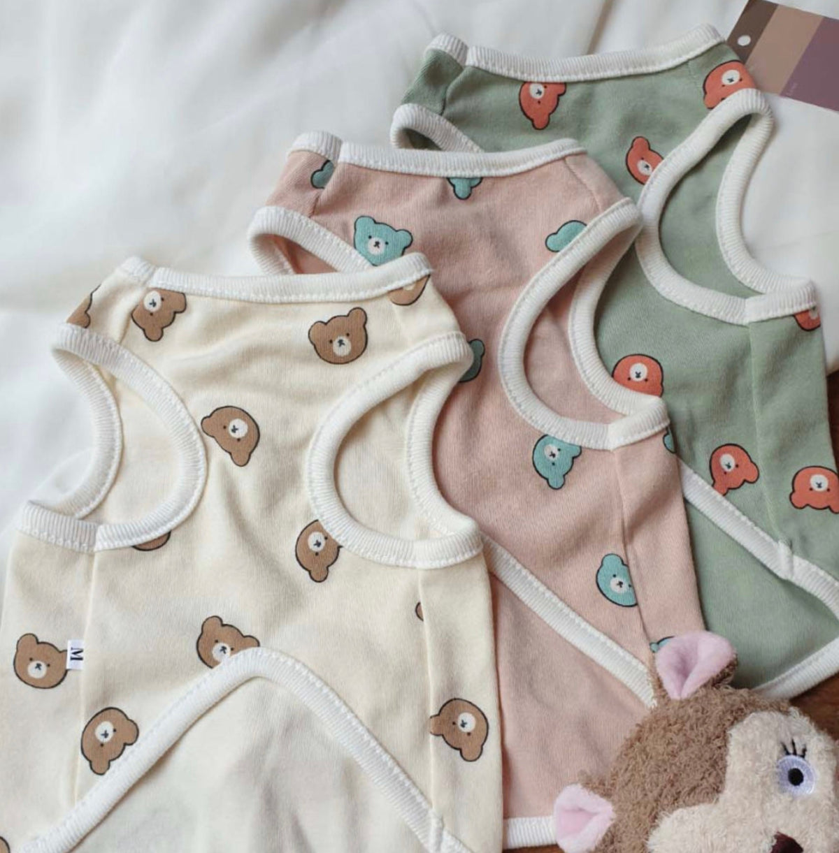 NKpup Bear Face Dog Tank Top in cream, pink, and sage green colors with bear patterns.