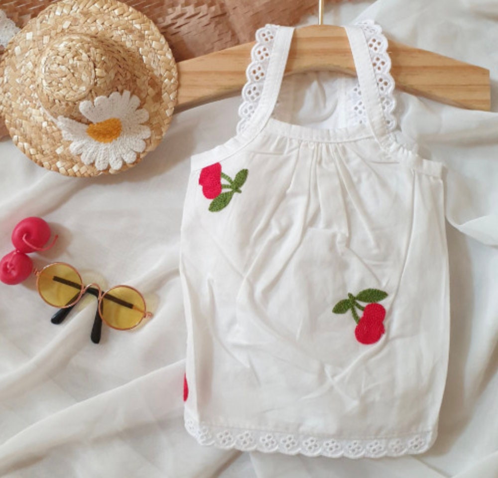 White cozy embroidered dog tank top with red cherry patterns and lace trim