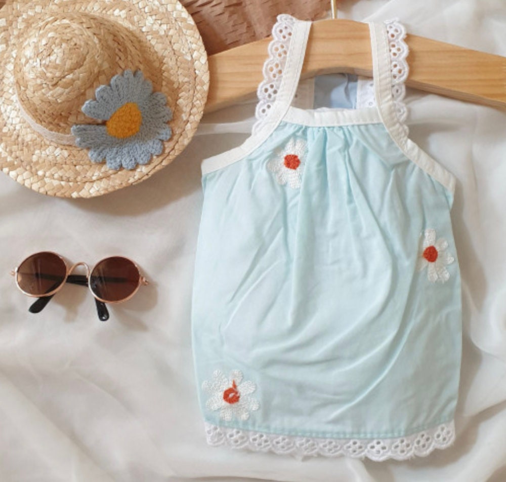 Cozy light blue embroidered dog tank top with white floral patterns and lace trim