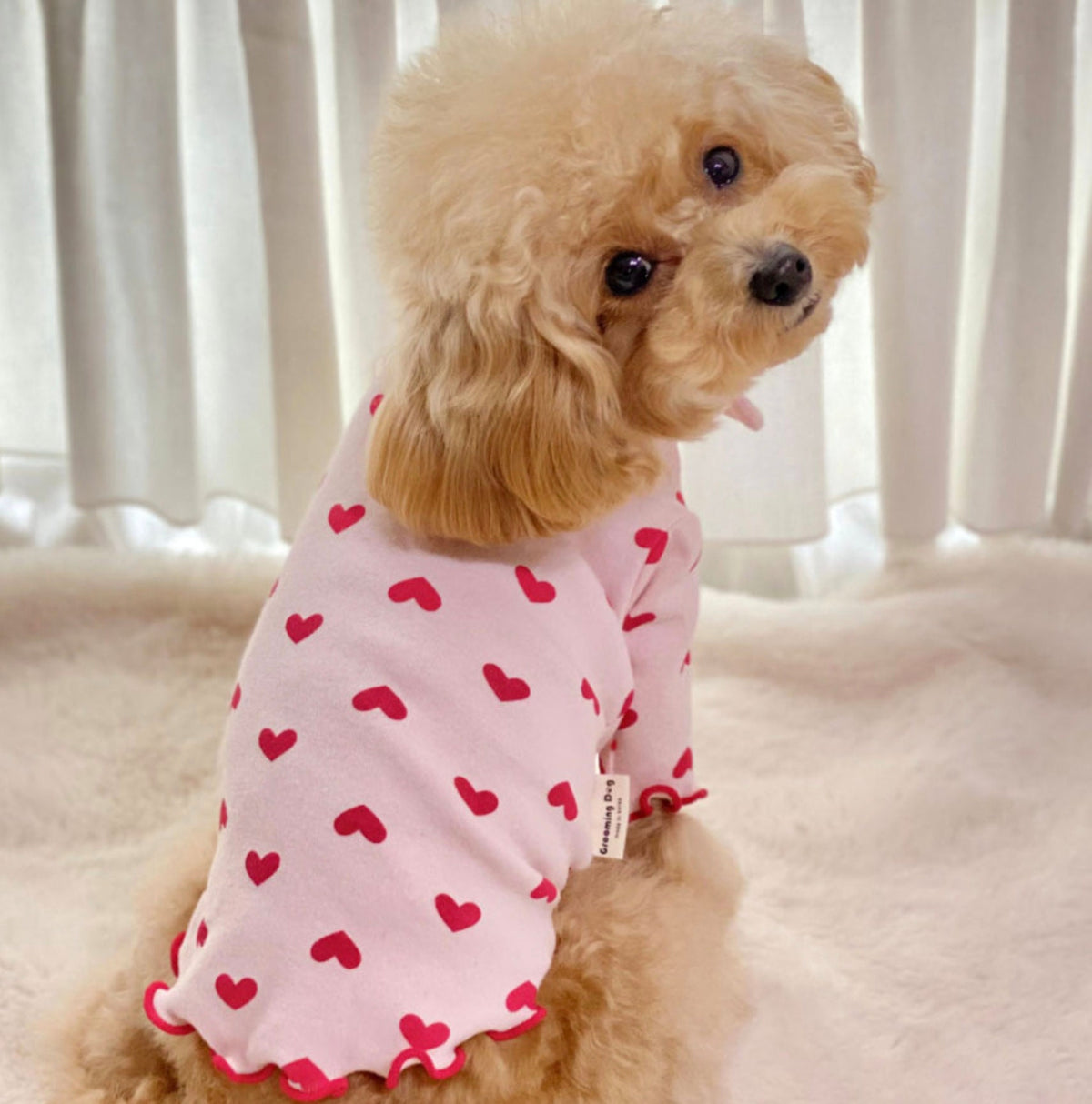 NKpup pink dog shirt with red heart pattern and ruffled edges