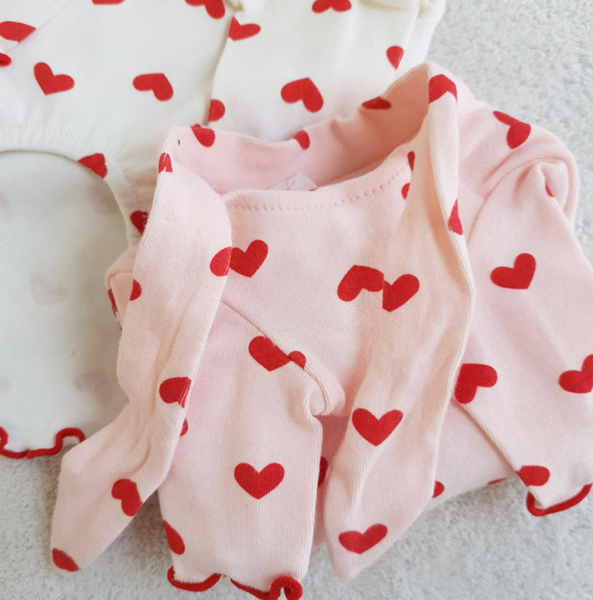 Pink Heart Tie Dog Shirt with red heart pattern and ruffled edges