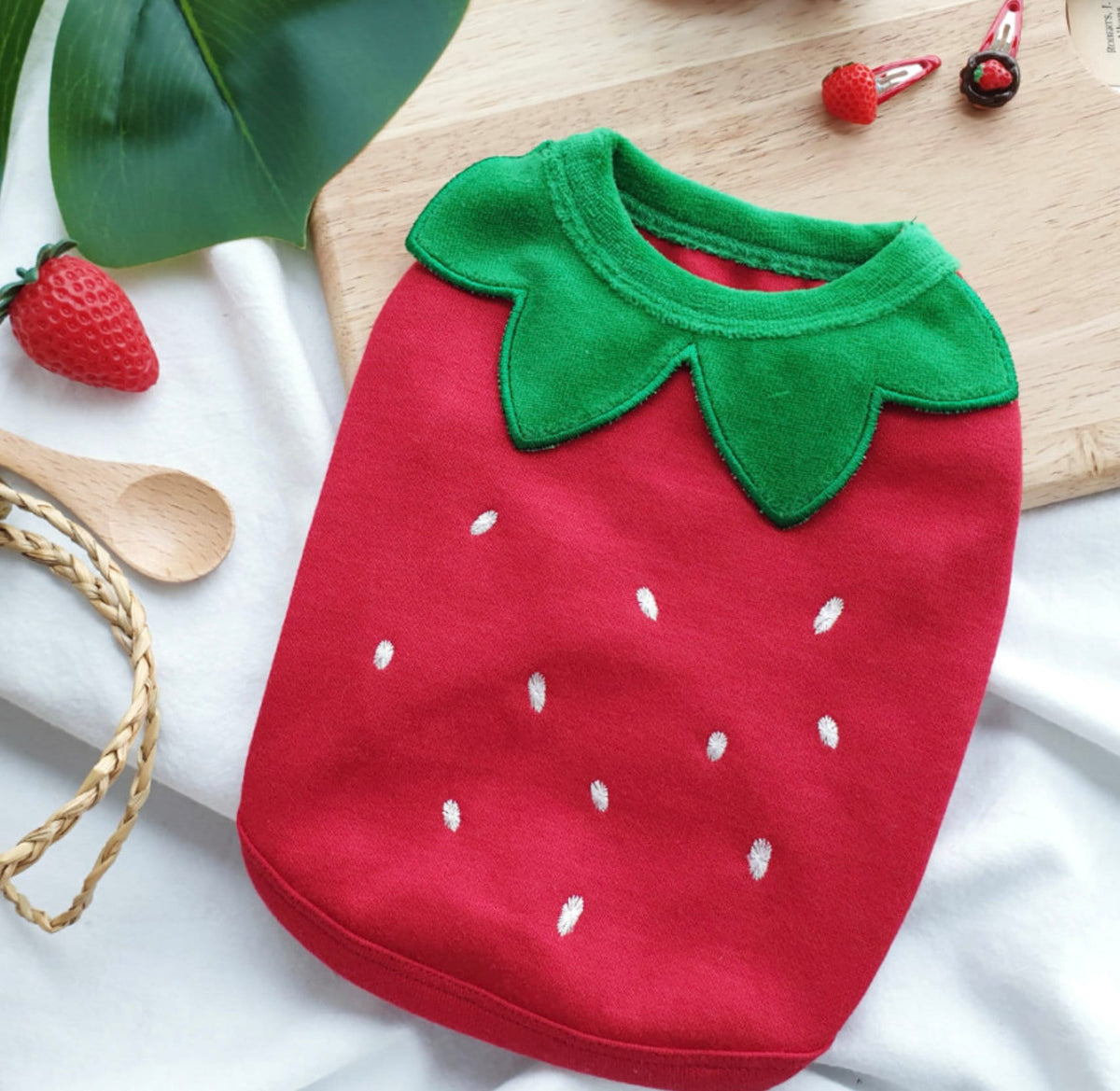 Halloween strawberry fleece dog shirt with green leaf collar and white seed pattern.