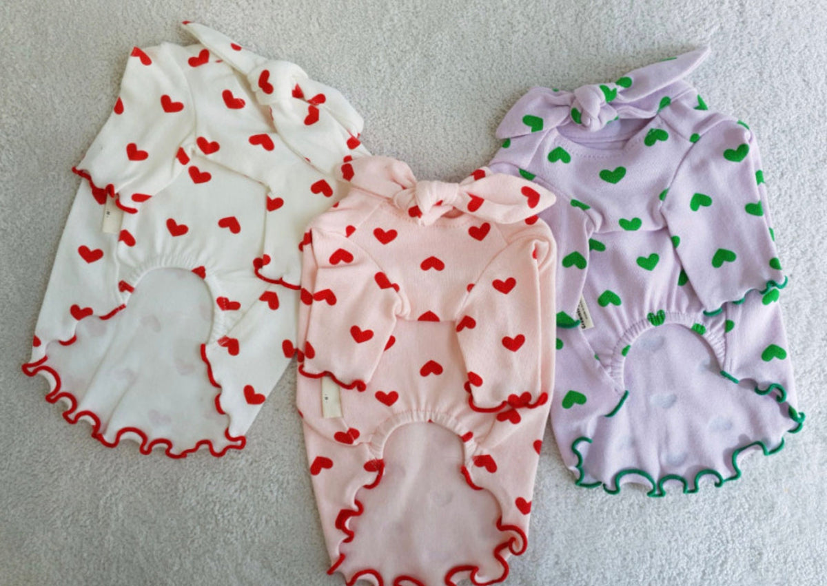 NKpup Heart Tie dog shirts in white, pink, and lavender with red, pink, and green heart patterns.