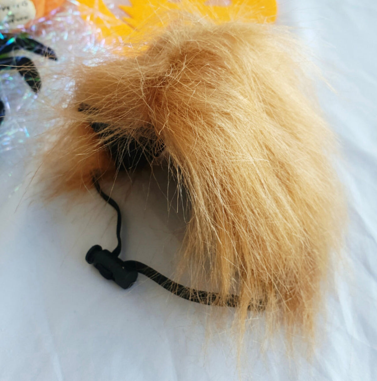 Chucky-inspired orange faux fur wig accessory for Halloween dog costume