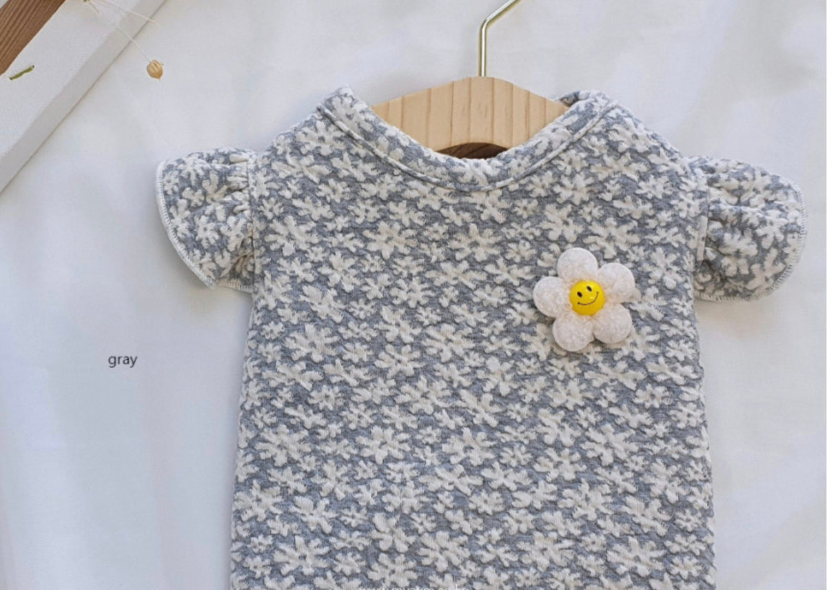 NKpup Floral Quilted Sleeveless Gray Dog Vest with a white flower smiley face patch