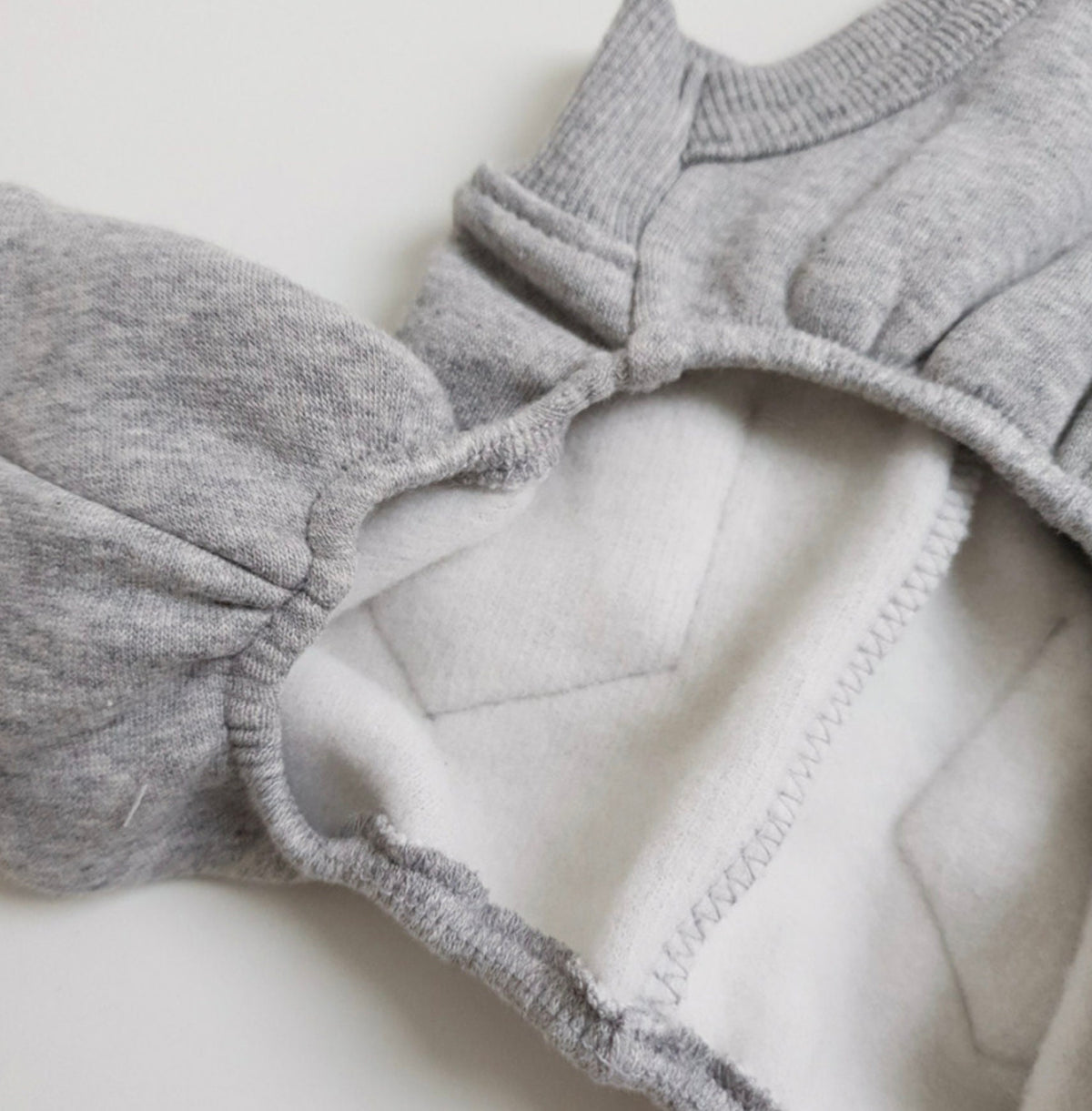 Grey fleece dog suspender overall with soft white lining by NKpup