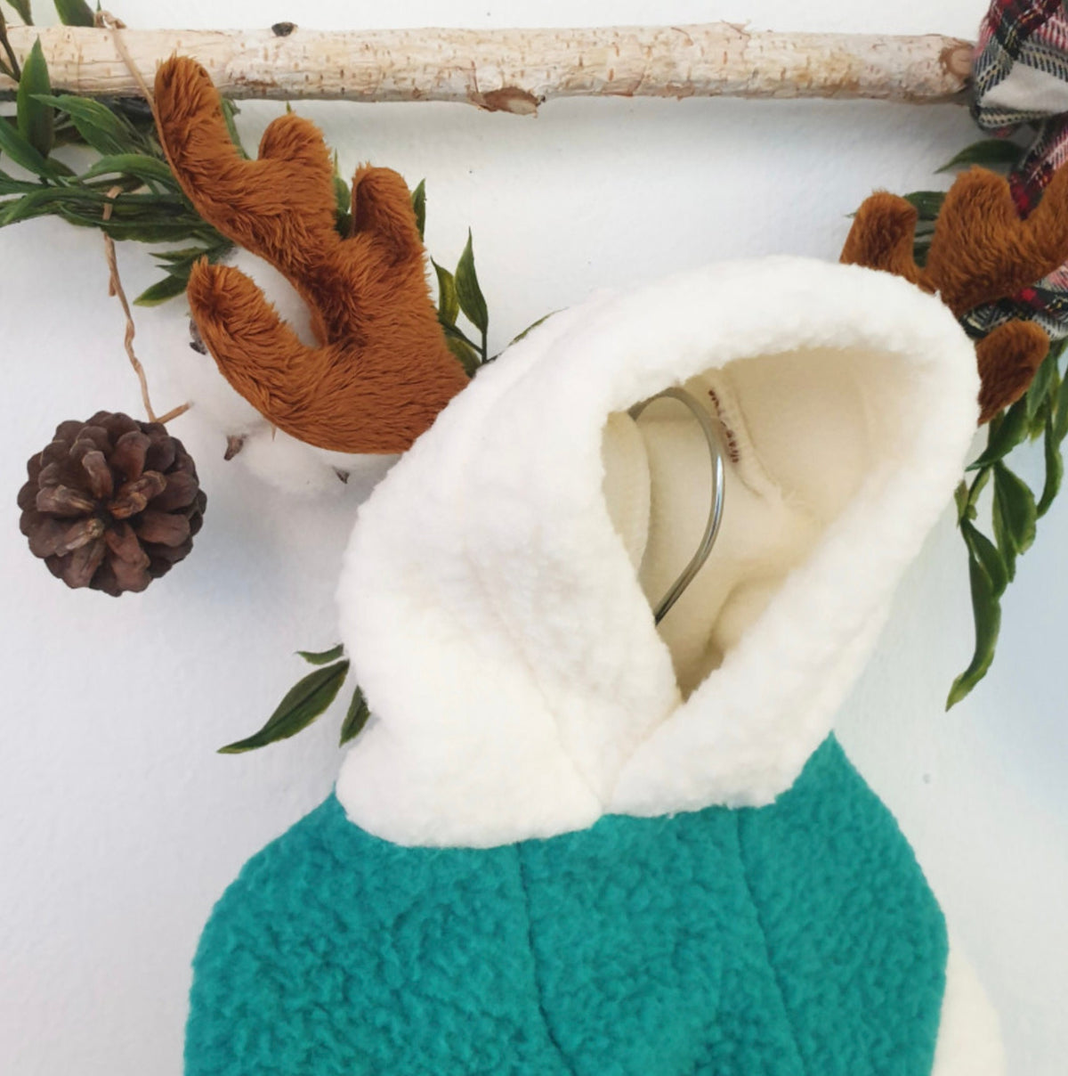 NKpup teal fleece dog hoodie with white lining and brown reindeer antlers