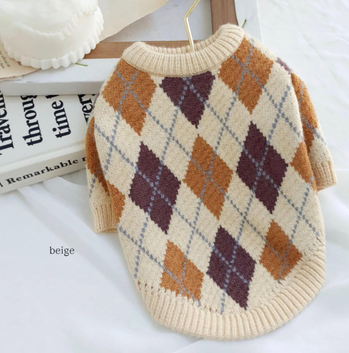 Beige argyle knit dog sweater with brown and purple diamond patterns