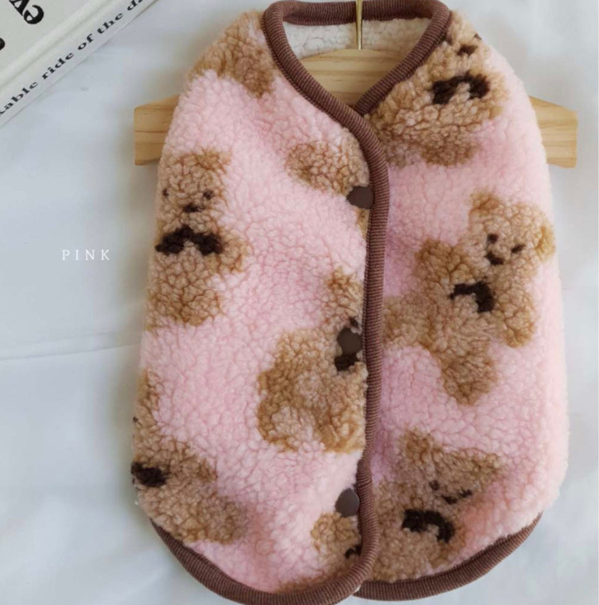 Pink reversible bear fleece dog vest with brown teddy bear pattern