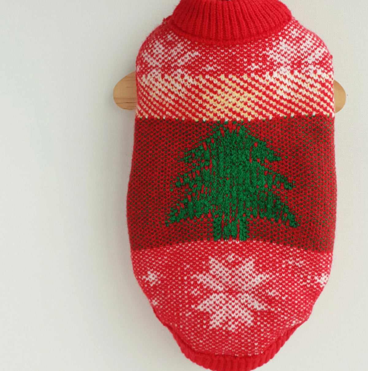 Red Christmas tree knit dog vest with white snowflake patterns