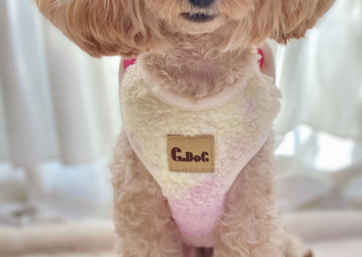 NKpup Aurora Boa Fleece Dog Vest in creamy white with subtle pink accents and a brown logo patch