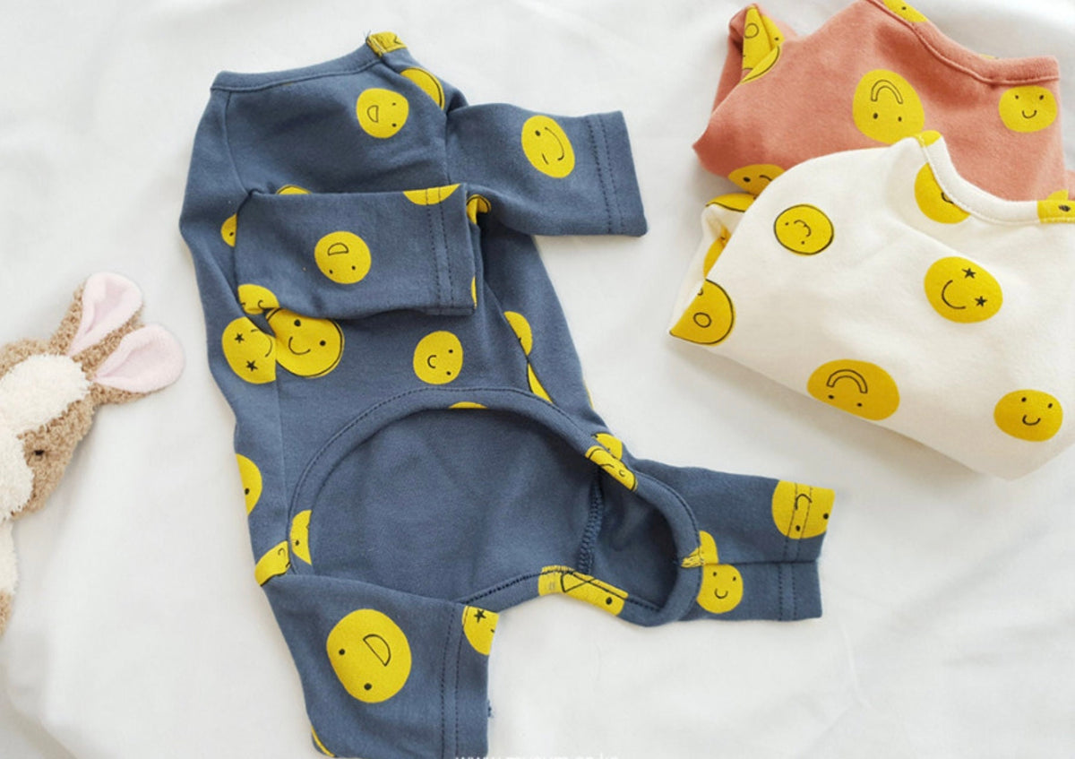 Smile Face Dog Overall in blue, white, and peach colors with yellow smiley face pattern