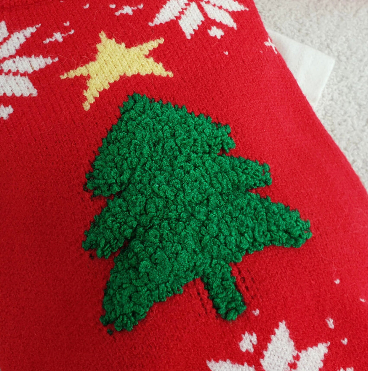 Red Christmas tree knit dog vest with a green textured tree and yellow star pattern