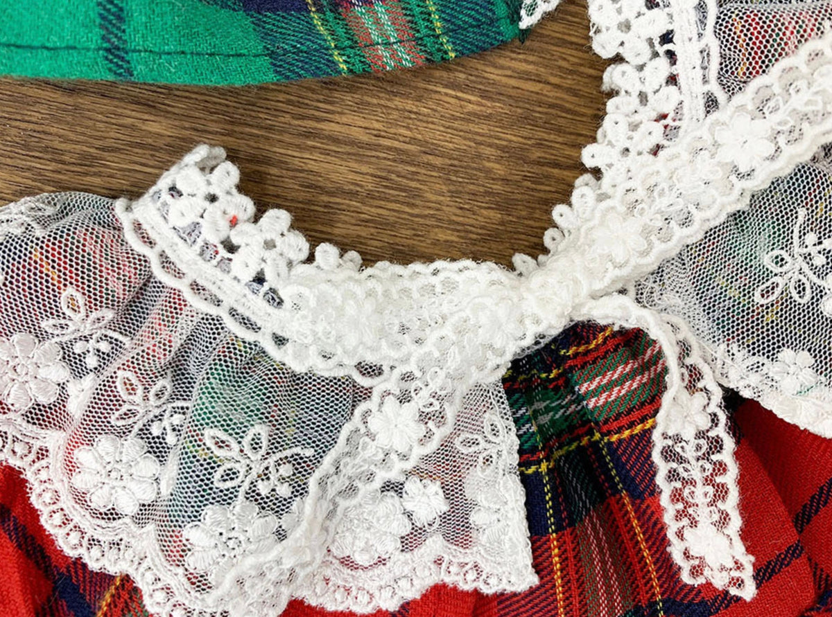 Christmas plaid dog cape with white lace trim and floral embroidery