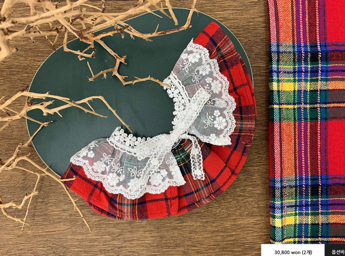 Christmas plaid dog cape with white lace trim in red and green pattern