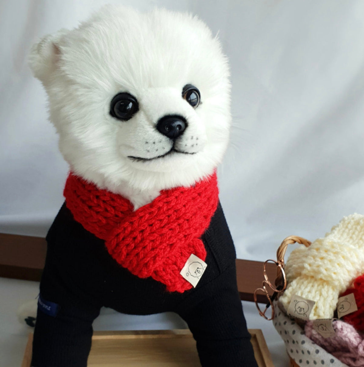 NKpup handmade knit dog scarf in vibrant red paired with a black dog sweater
