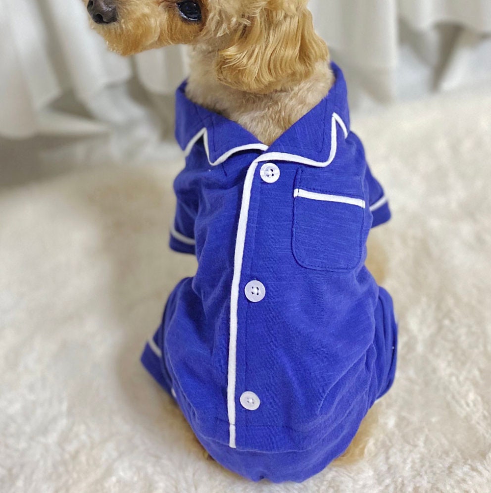 NKpup solid blue dog pajamas overall with white trim and button details