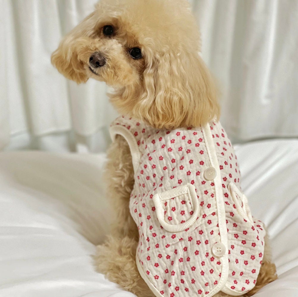 Crinkle floral dog vest in white with red flower pattern and button details