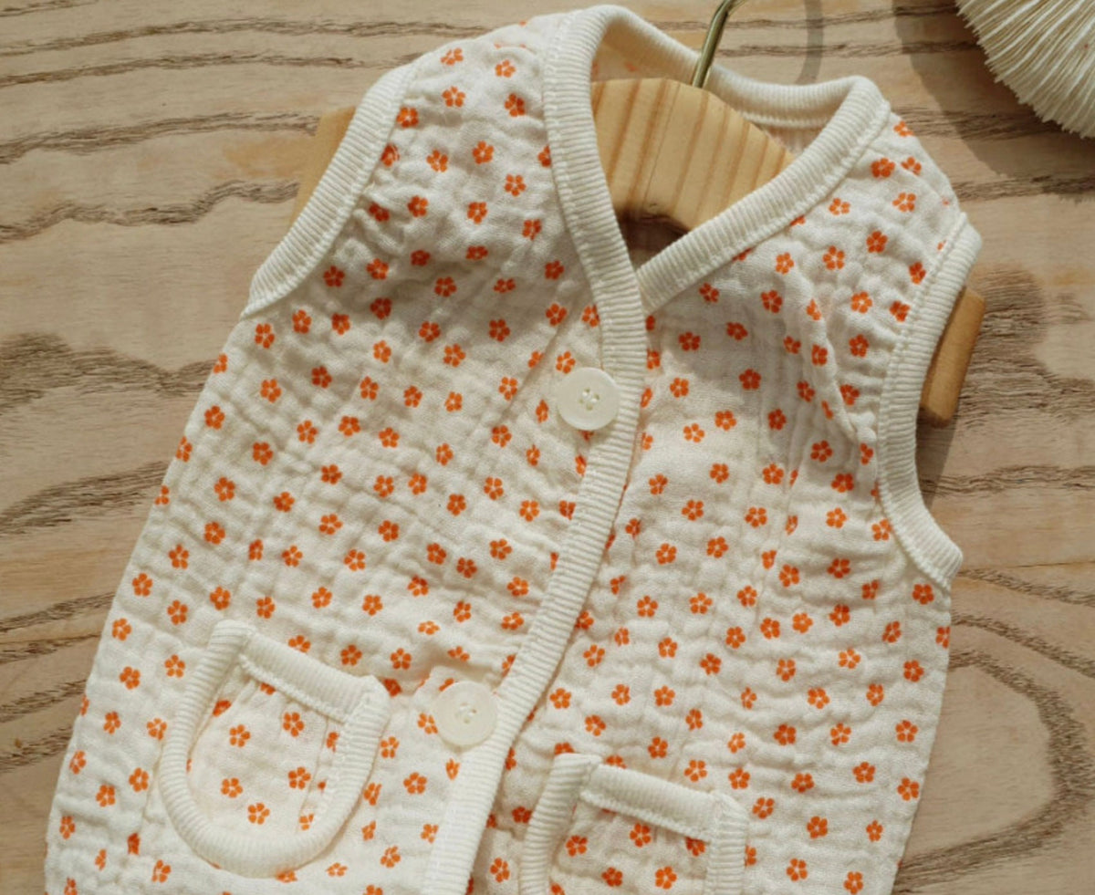 NKpup Crinkle Floral Dog Vest in white with orange flower pattern