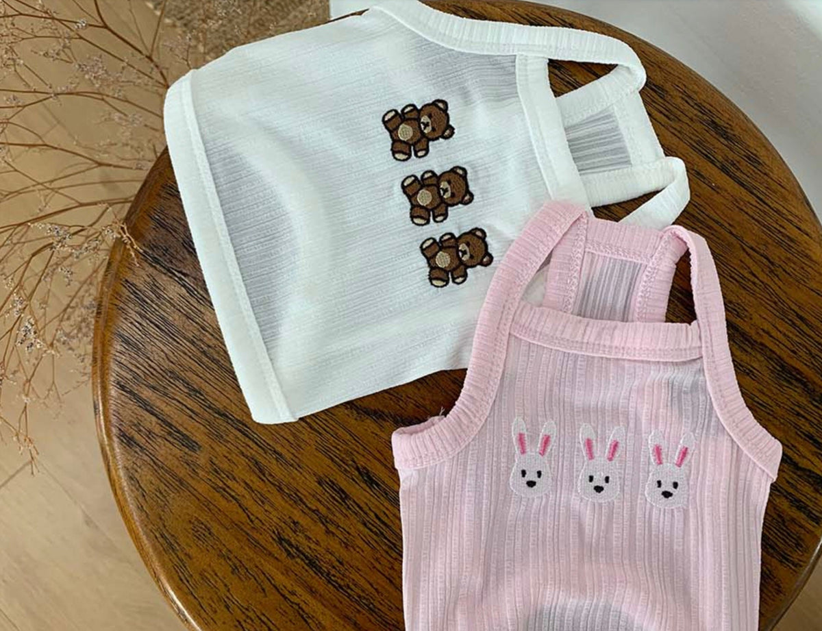 White and pink NKpup Animal Garden dog crop tank tops with bear and bunny embroidery.
