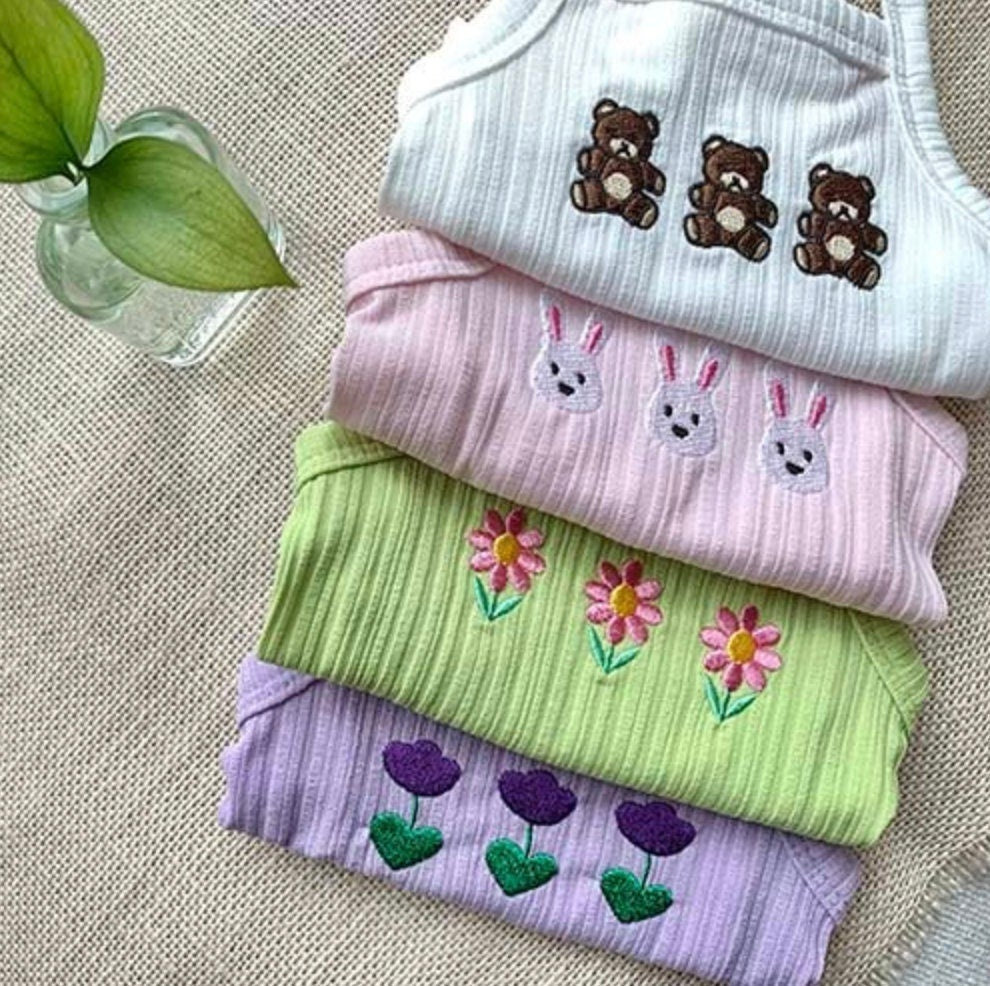NKpup Animal Garden dog crop tank tops in white, pink, green, and purple with cute animal and flower embroidery