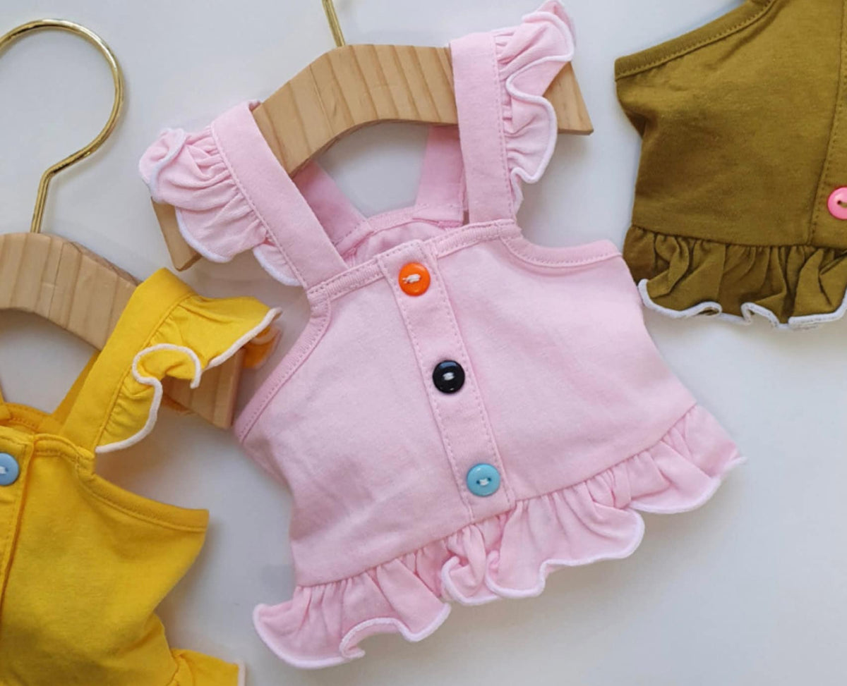NKpup frilled dog crop tops in pink, yellow, and mustard with colorful buttons and ruffled edges