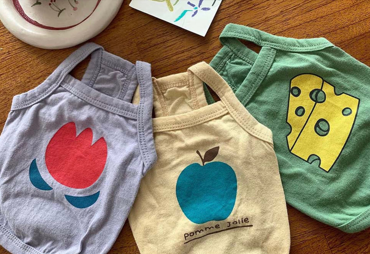 NKpup washed cotton sleeveless dog shirts in purple with tulip, beige with apple, and green with cheese patterns