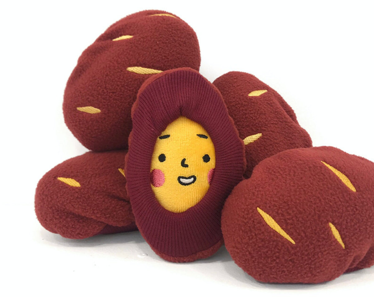 NKpup Snuffle Sweet Potato Dog Toy featuring a smiling yellow face and red potato-shaped plush elements.