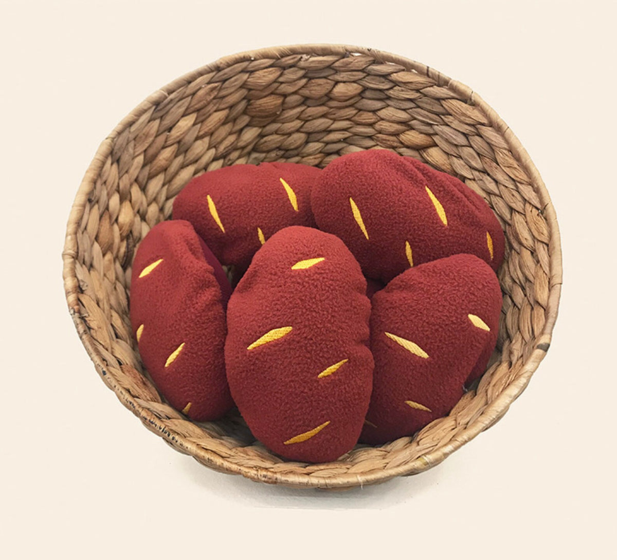 NKpup Snuffle Sweet Potato dog toys in a woven basket