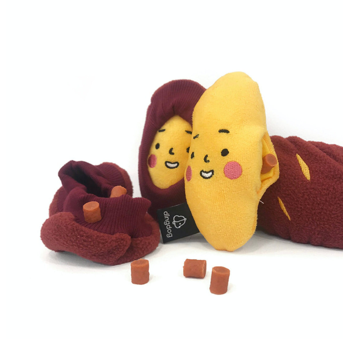 Snuffle Sweet Potato dog toy featuring a yellow potato character and a maroon fabric base with small treats.