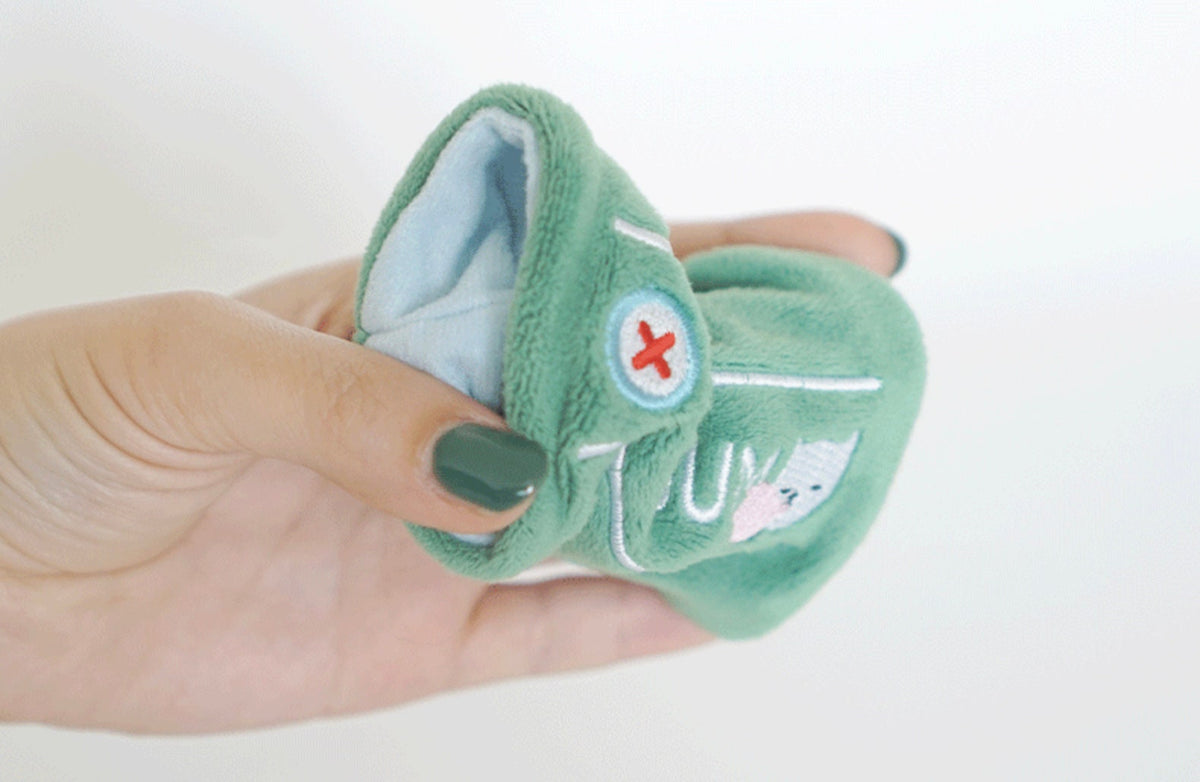 Green Snuffle Chewing Gum Dog Toy by NKpup with soft plush texture and white accent details.