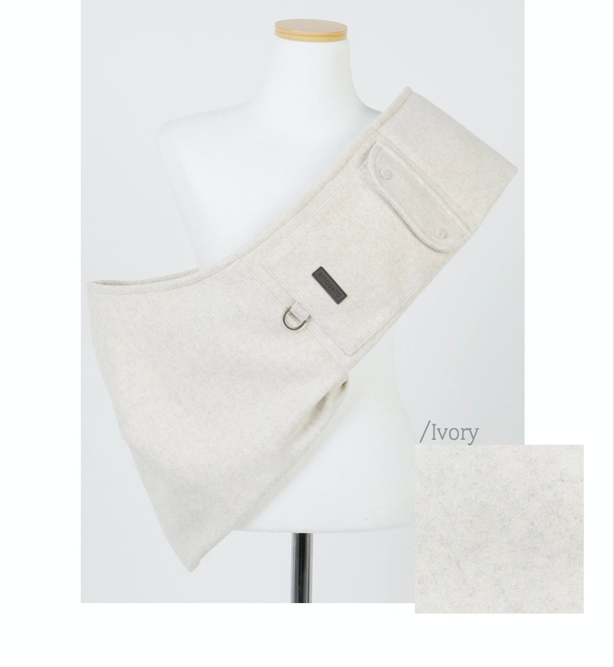 Ivory wool pet sling carrier by NKpup with a side pocket and adjustable strap.