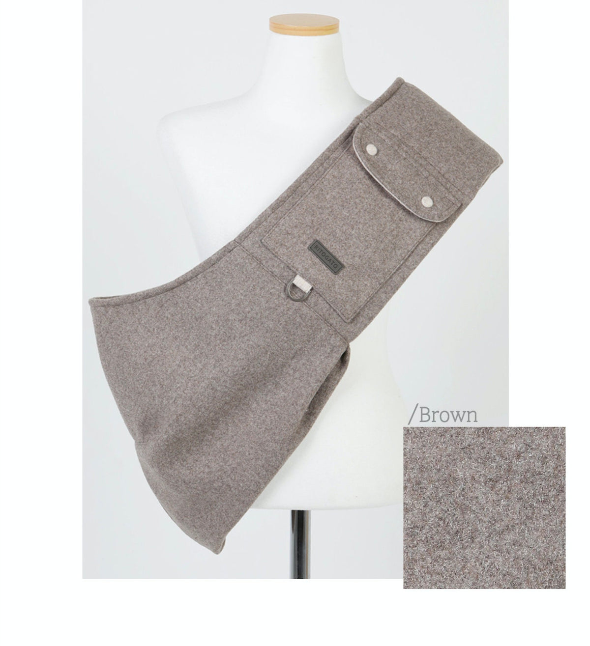 Brown NKpup wool pet sling carrier with button closures and adjustable strap.