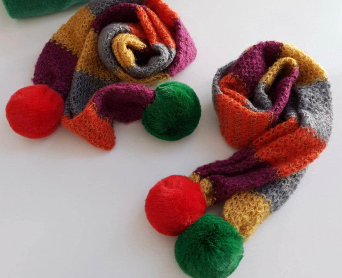 NKpup Christmas Color Block Dog Scarf in multi-color knit with red and green pom-poms